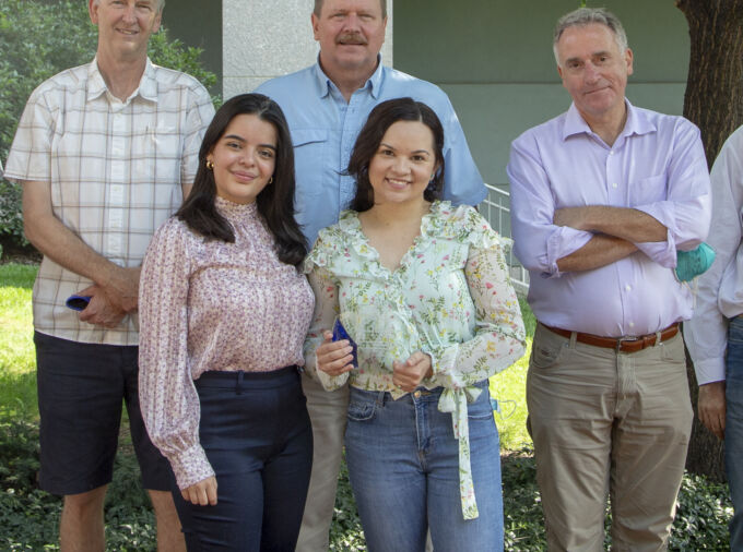 Jim Marden, Troy Ott, Andrew Read, Maria Solares, Isabel da Silva standing outside the Huck Life Sciences Building. Isabel is holding a plaque