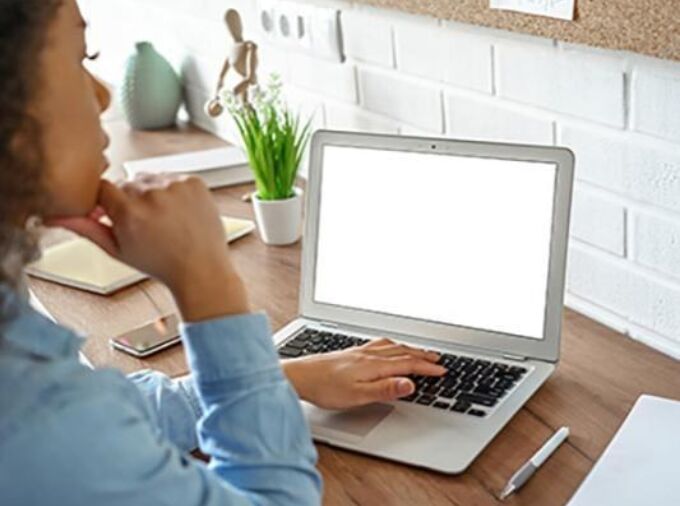 A student works on a laptop. Credit: Adobe Photo Stock. All Rights Reserved.