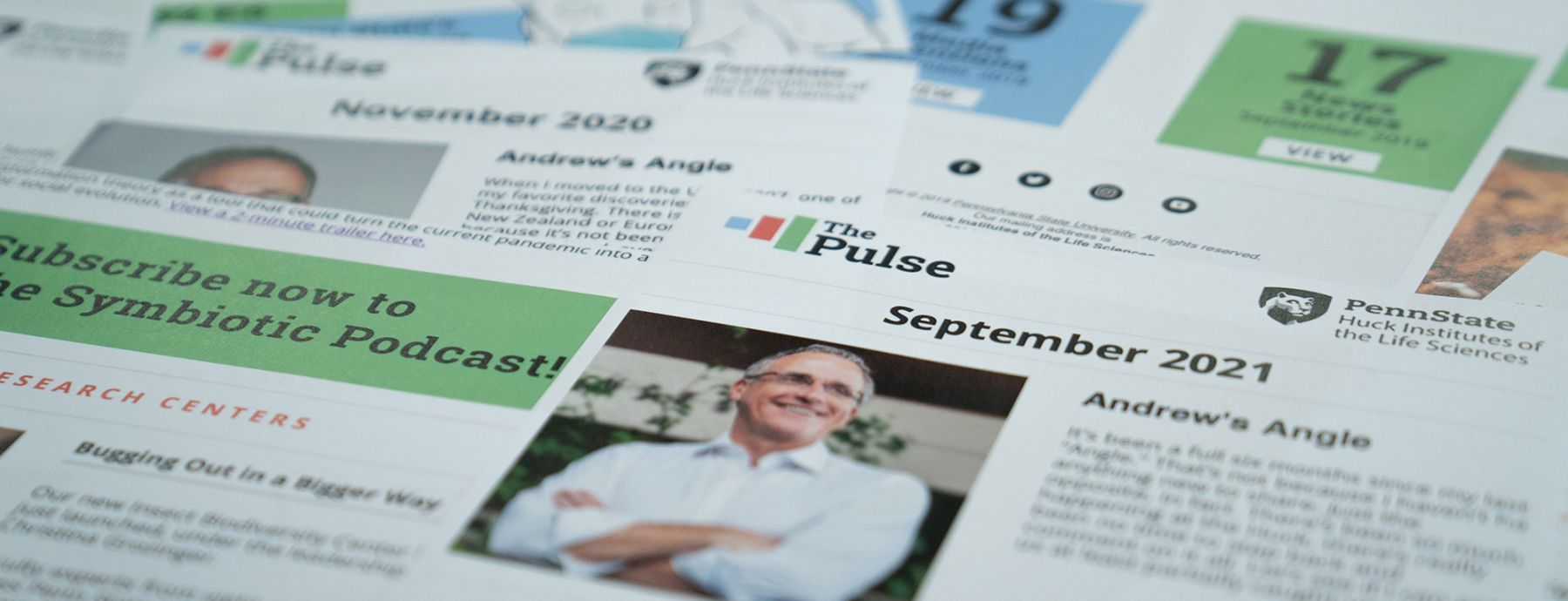 The header image depicts several issues of The Pulse printed out and displayed on a desk.