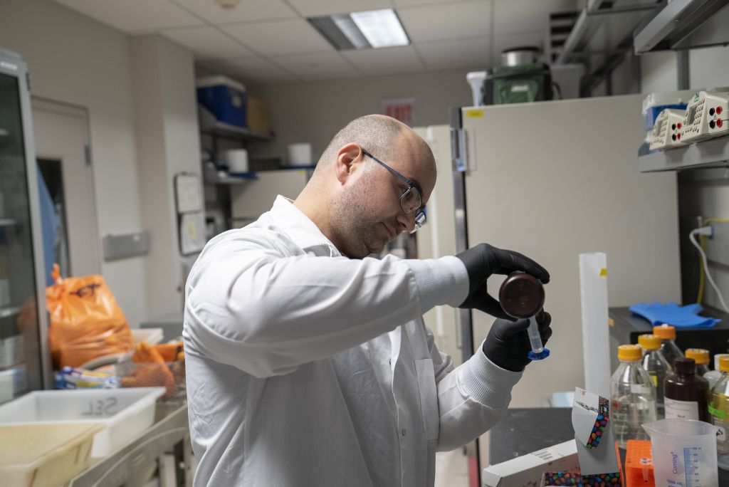Chad Kuny working in a lab