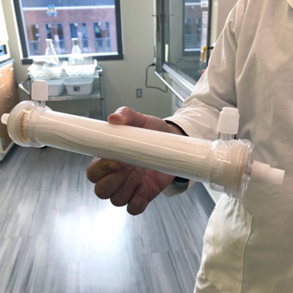 Dr. Zydney holds a tube of membranes used for filtration.