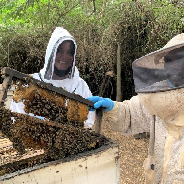Darcy Gray, a graduate student in Penn State's intercollege graduate degree program in ecology, is studying honey bees in Kenya. At right is Joseph Kilonzo, research assistant, International Centre of Insect Physiology and Ecology. Credit: Michael Muturi. All Rights Reserved.