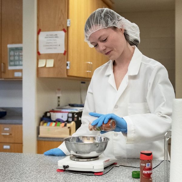 A team of researchers at Penn State found that increasing spiciness slightly using dried chili pepper slowed down eating and reduced the amount of food and energy consumed at a meal, all without negatively affecting the palatability of the dish. The study was led by Paige Cunningham, pictured, a postdoctoral researcher who earned her doctorate in nutritional sciences from Penn State in 2023. Credit: Patrick Mansell / Penn State. Creative Commons