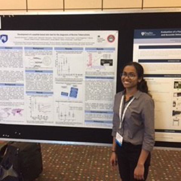 Sreenidhi Srinivasan with her award-winning poster "Development of a peptide-based skin test for the diagnosis of Bovine Tuberculosis"