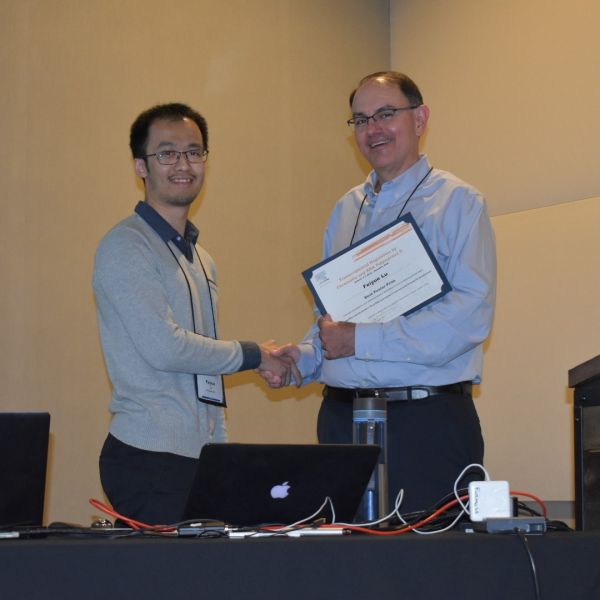 Meeting co-organizer and BMB Professor Joe Reese presents Feiyue Lu with the BBA-Gene Regulatory Mechanisms Poster Award
