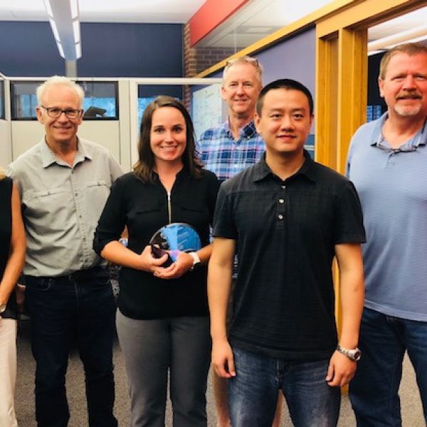 Five members of the Huck Graduate Student Advisory Committee pose to celebrate outgoing graduate adviser, Kelly Ness