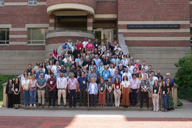 Group photo of Forest Genetics 2025 attendees standing on the steps of Penn State's Agricultural Science and Industry building
