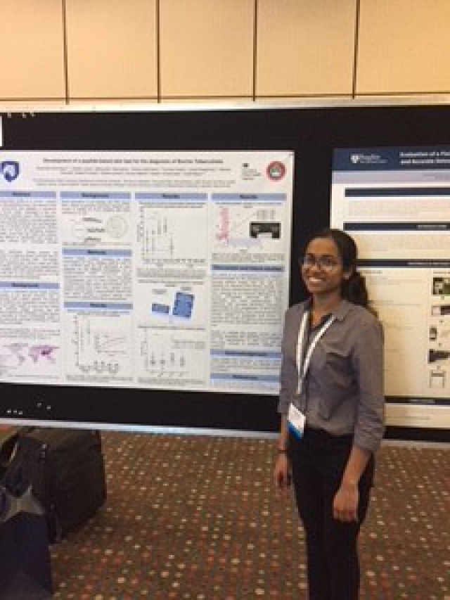 Sreenidhi Srinivasan with her award-winning poster "Development of a peptide-based skin test for the diagnosis of Bovine Tuberculosis"